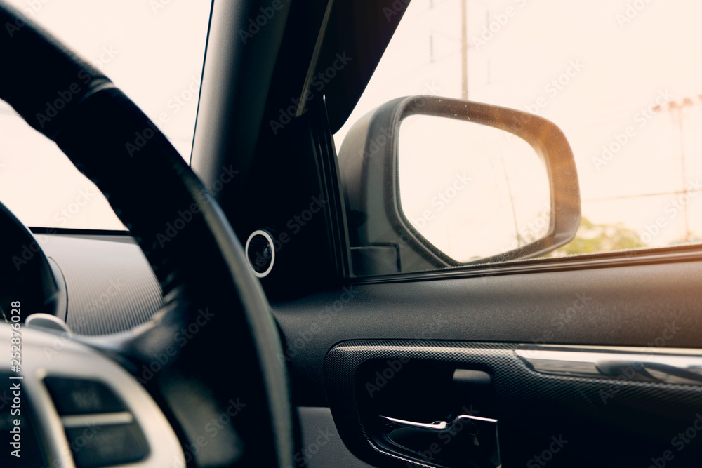 Drive the car out to relax with the view of driving inside. Look at the driver's side mirror.