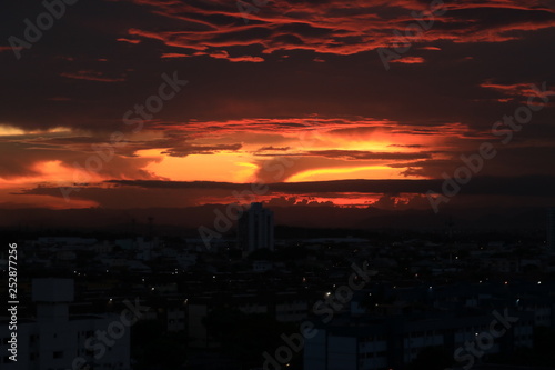 A beautiful sunset in urban landscape like an eruption of the sun. Vila Velha/ES