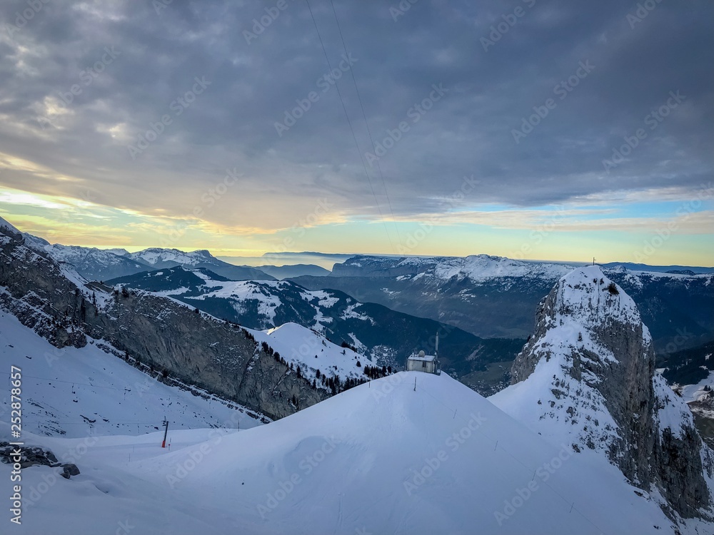 Beautiful sunset in Alps mountains winter destination