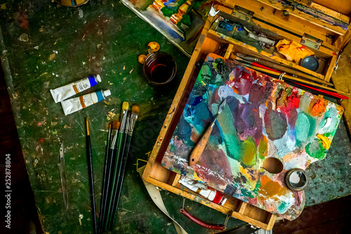Workplace of the artist with brushes and oil paints