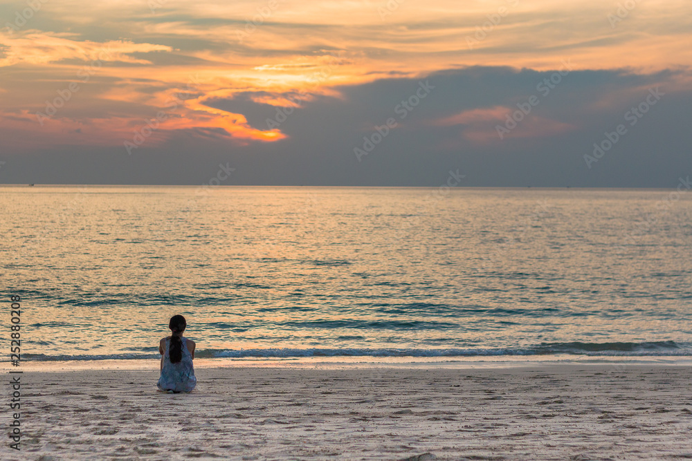 silhouette of woman on the beach at sunset,Long beach,Koh Lanta,Thailand.February 2019.