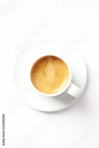 Cup of coffee isolated on white background. Top view. Copy space.
