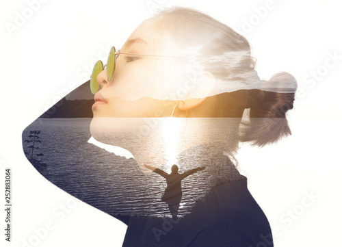 Double exposure portrait of an Asian young woman with retro sunglasses combined with a photograph of a sunset over the lake and silhouette women.