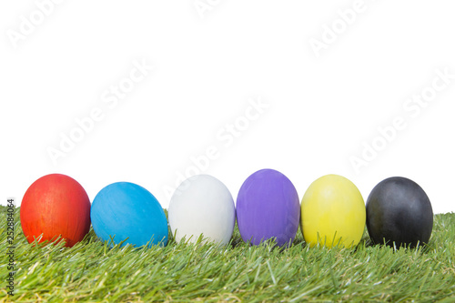 Colorful handmade easter eggs on green grass