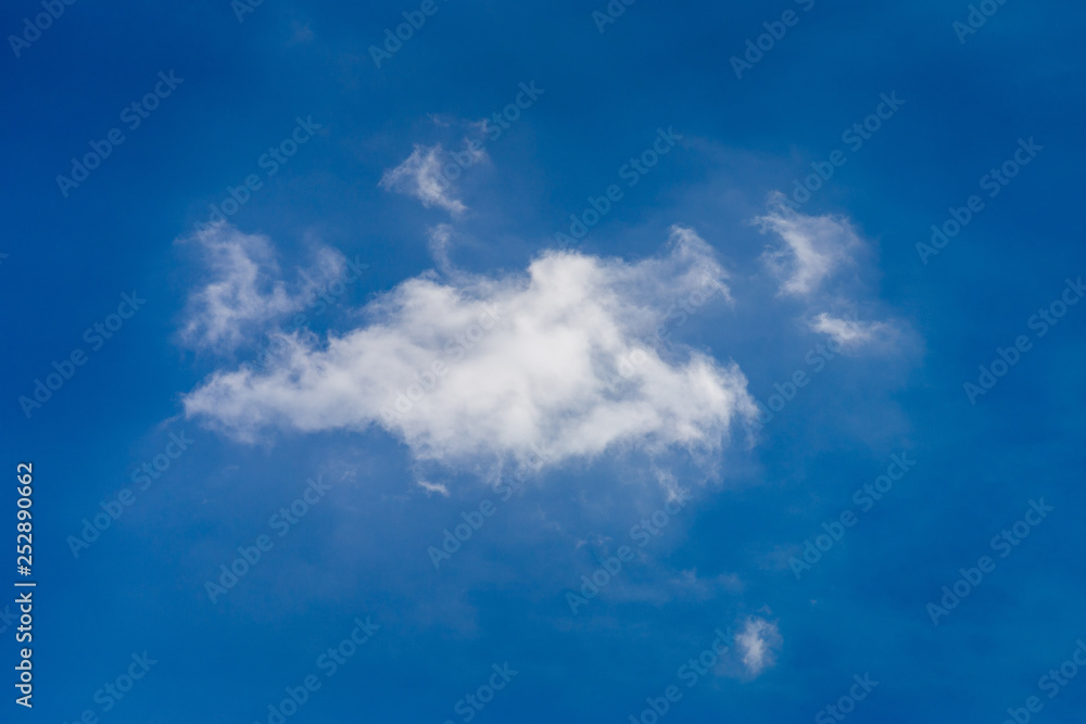 Fluffy white clouds on a blue sky, background Fluffy white clouds on a blue sky, background