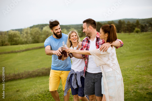 Happy group of friends having fun and smiling at nature