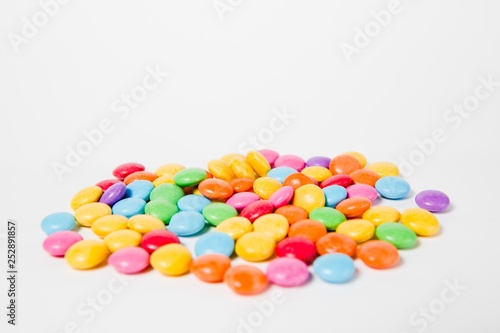 Pile of colorful sweets candies - side view.