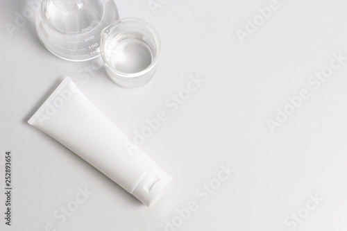 cosmetic beauty container product with test tube lab bottle glass top view