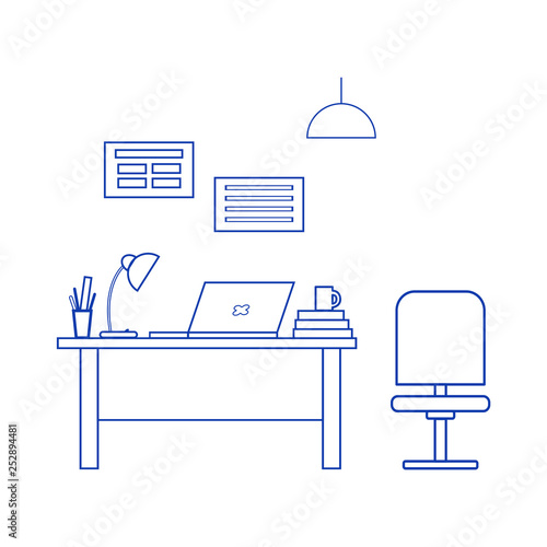 Office interior. Workplace: table, chair, laptop, table lamp, posters. Office furniture, modern furnishings.