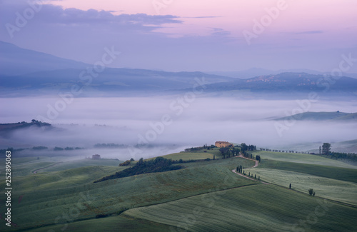 Beautiful morning landscape with fog in Tuscany, Italy.
