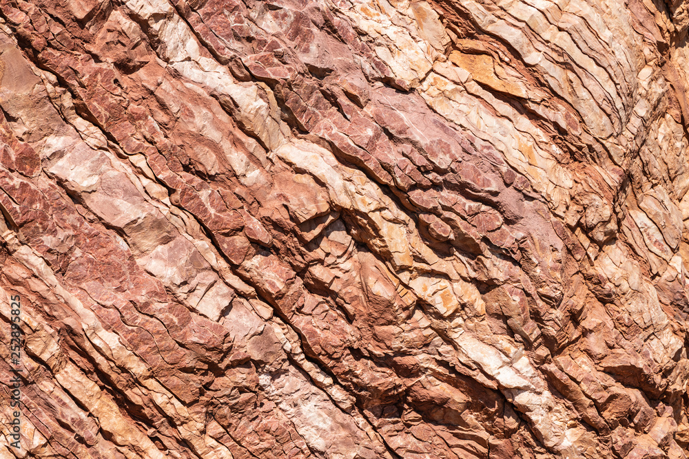 Stone wall texture. Rock of red stone.
