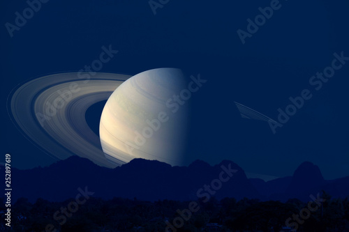 saturn back  silhouette mountain on cloud and night sky