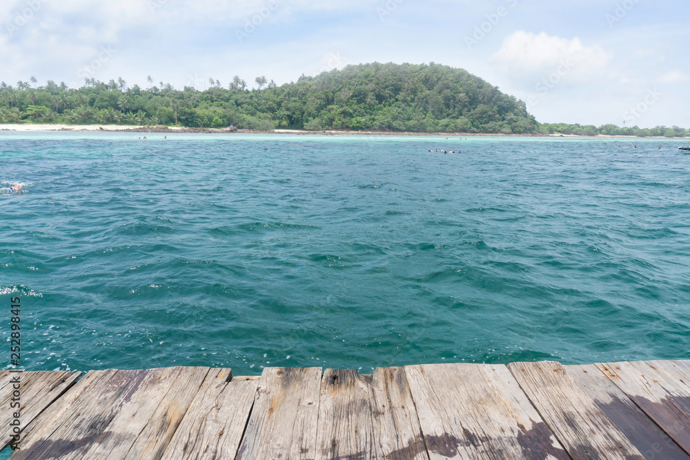 Fototapeta premium Pov on raft with people snorkeling in sea