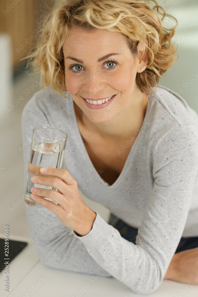 satisfied young woman drinking water satisfied young woman drinking water