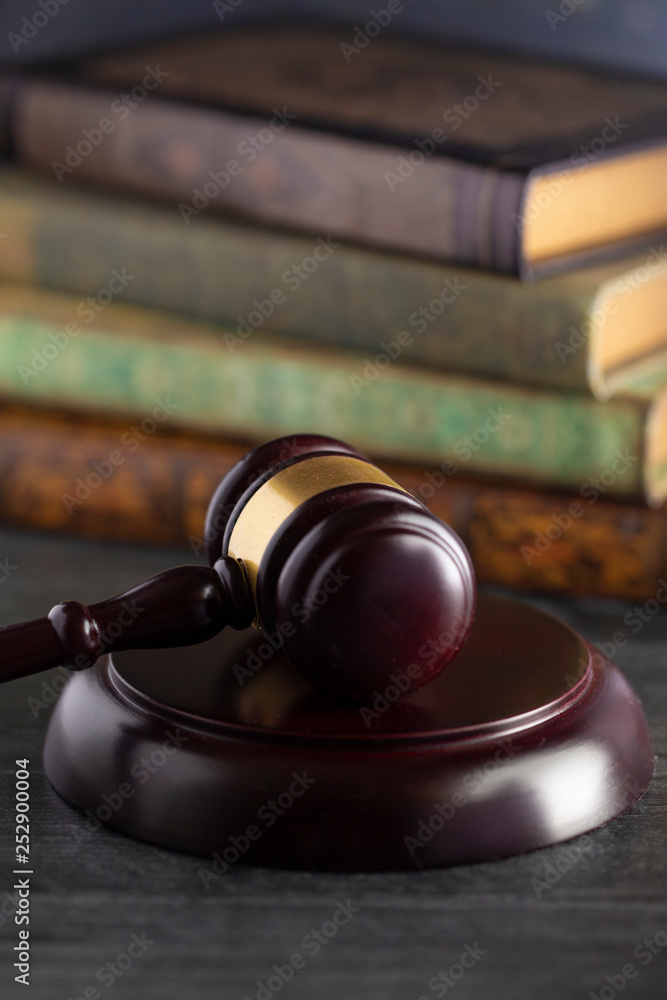 Judges Gavel on a Desk with Books in the Background
