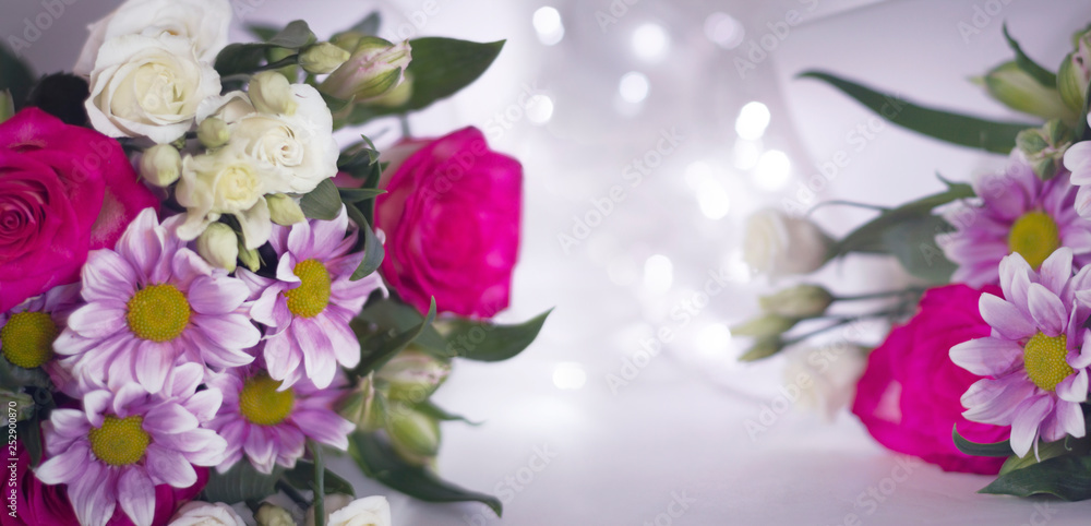 Floral festive background template. A bouquet of flowers on a light background bokeh.