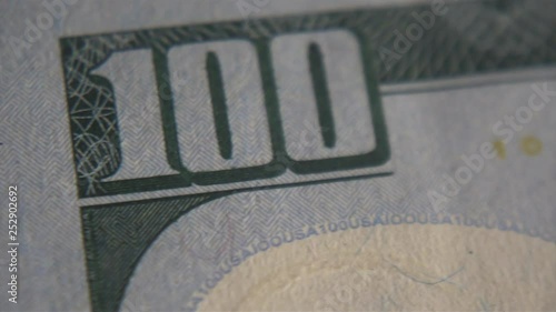 Macro. Dollar bills, money background. Portrait of George Washington closeup on the bills for a hundred dollars. Dollars, money close up.