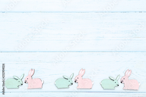Easter rabbits on wooden table
