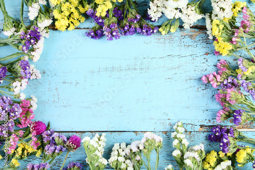 Spring flowers on blue wooden table