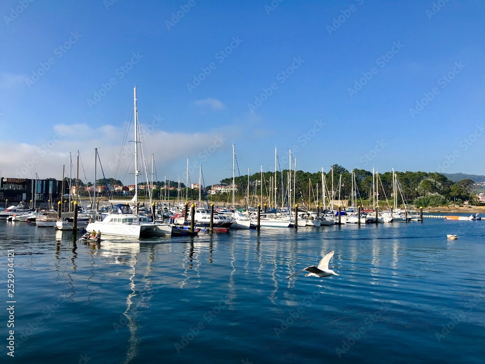 View from the pier with boats at the distance in Sanxenxo Galicia Spain