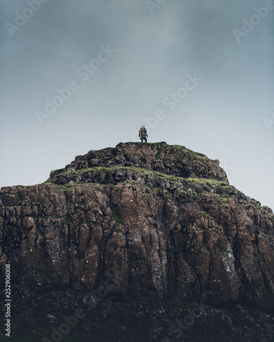 Obraz na plátně Man reached a hilltop in scotland summit goal success overlook panorama