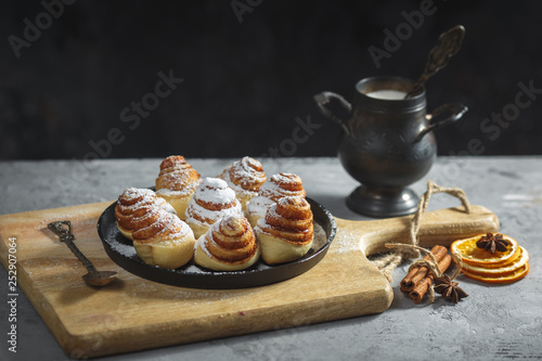 cinnamon rolls sinabon made at home, lying on a grey table. Homemade cakes photo