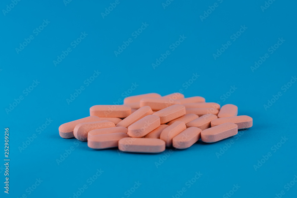 pills in blue background pills in blue background