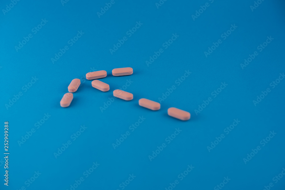 pills in blue background pills in blue background