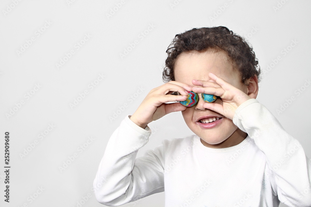 little boy with sweet chocolate Easter eggs little boy with sweet chocolate Easter eggs