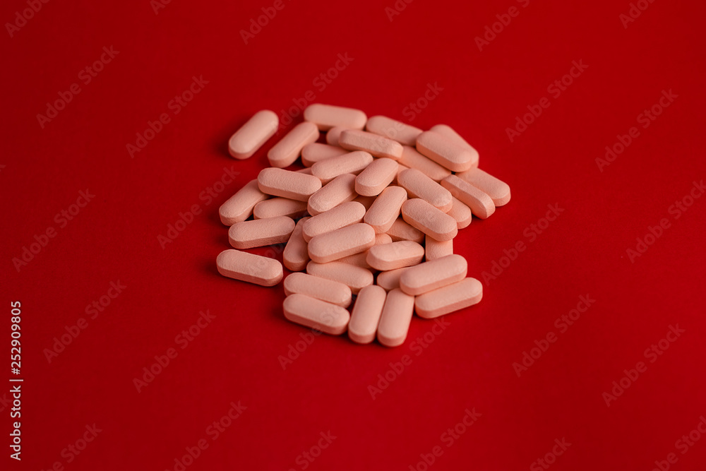 Pills with red background Pills with red background