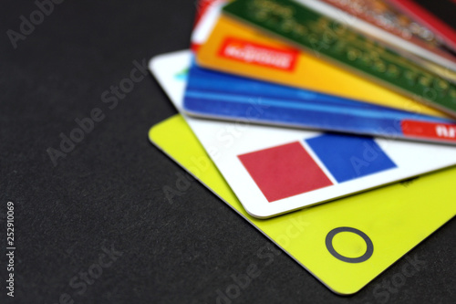 Different plastic cards for an ATM on a black background photo