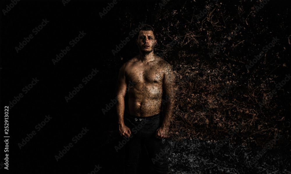 Young Man Muscle Portrait Shot On A Black Background
