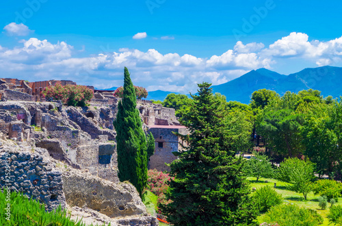 Pompeii  archeological site  Ancient ruins of dying city with mountains on the backside.