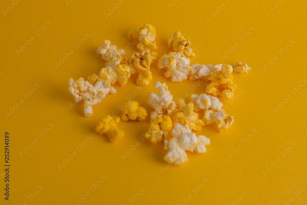 popcorn in yellow background popcorn in yellow background