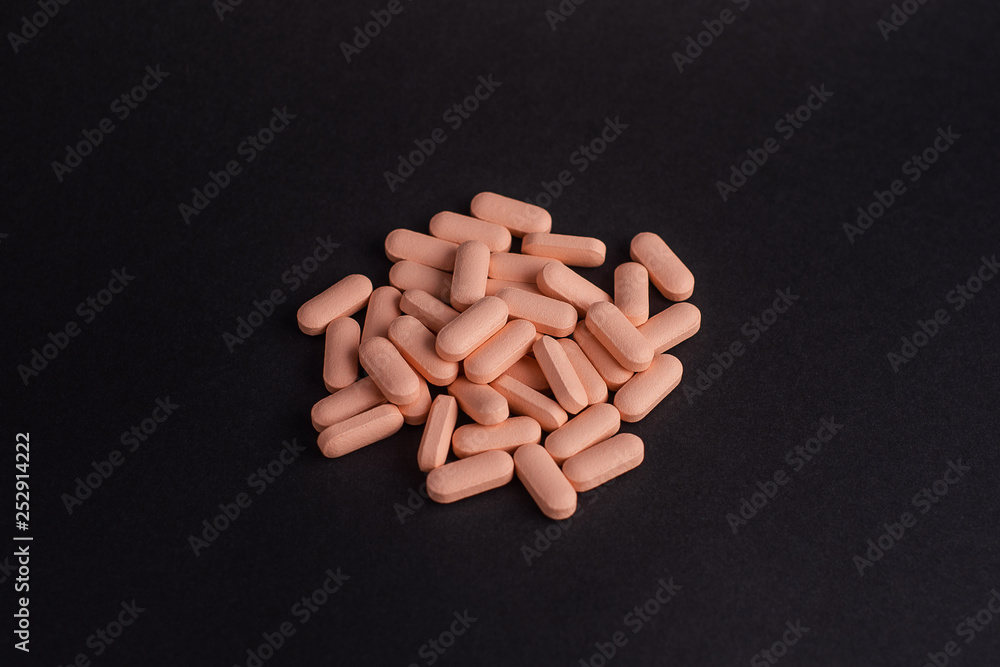 pills in black background pills in black background