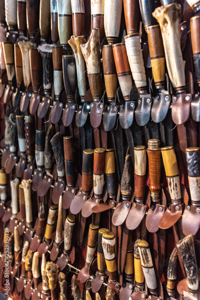 Lots of handmade blades inside their leather scabbards Lots of handmade blades inside their leather scabbards