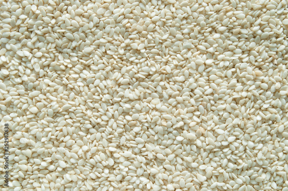 White sesame seeds for cooking top view, background. White sesame seeds for cooking top view, background.