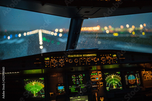 Pilot's hand accelerating on the throttle in  a commercial airliner airplane flight cockpit during takeoff