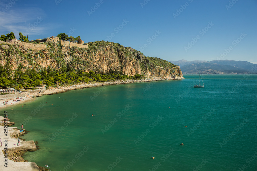 Fototapeta premium Mediterranean castle building waterfront vivid colorful landscape, summer sea cruise vacation concept photography