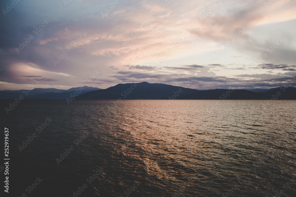 abstract unfocused twilight evening landscape view with fuzzy pink water stream surface abstract unfocused twilight evening landscape view with fuzzy pink water stream surface