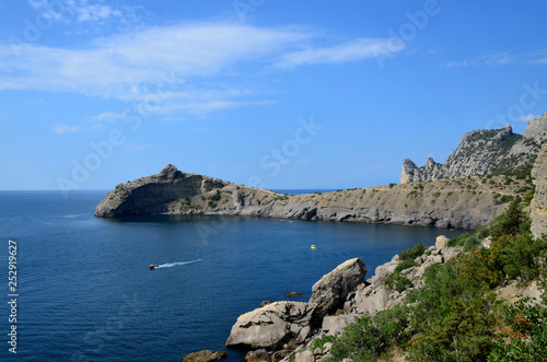 Cape Kapchik in the Black Sea near the village of Novy Svet sunny summer day. Mountain in the form of a dolphin, side view