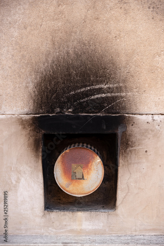 Принти на полотні Back of a gas heater or stove that burn and stain the wall with soot