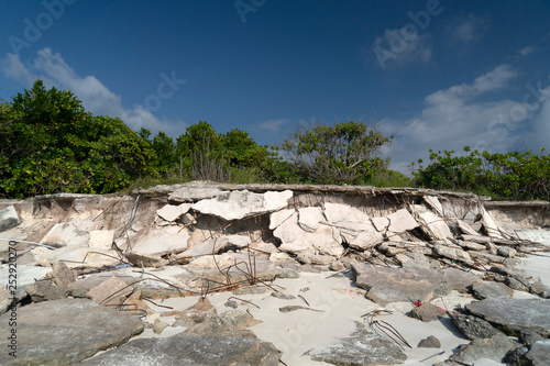 rubbish on tropical island paradise sandy beach photo