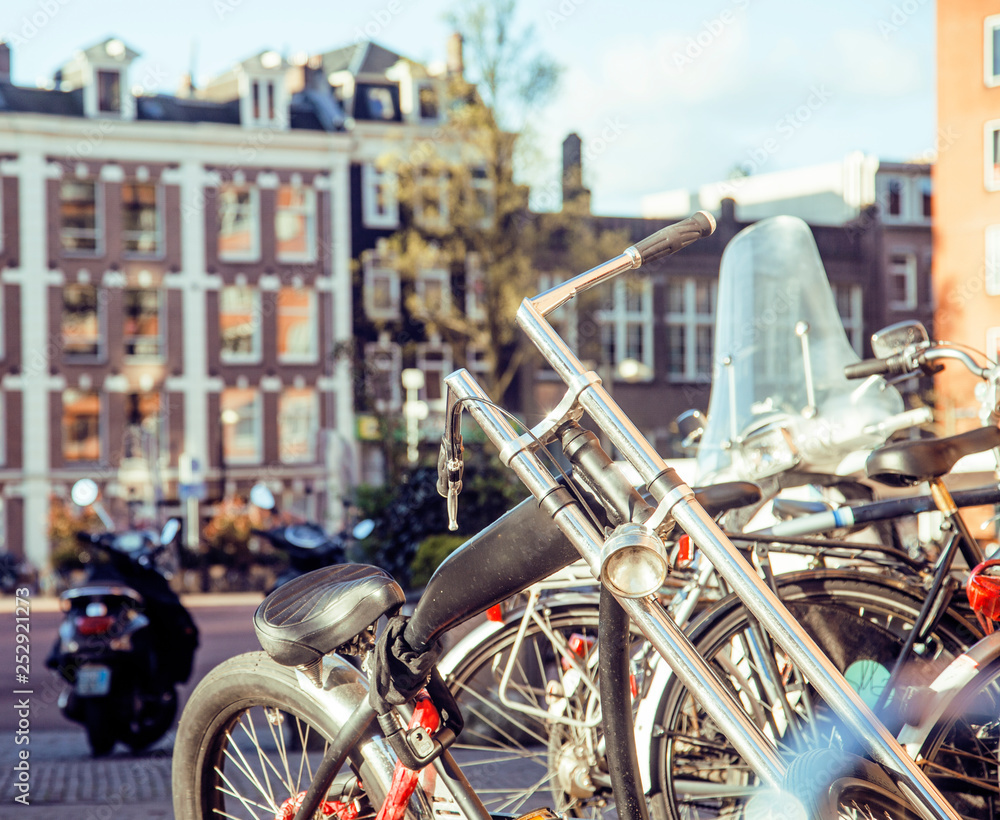 Obraz premium many bicycles on street of Amsterdam city, parking ideal traffic