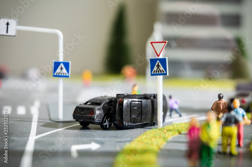 Miniature model of street intersection and car accident imitation