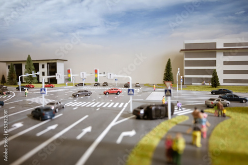 Miniature model of street intersection and a car accident