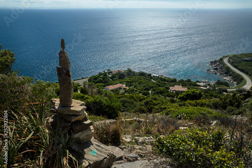 Top view on the mediterranean sea and the coastline road from the trail Sentier Botanique near Pietracorbara village at Cap Corse. France. photo