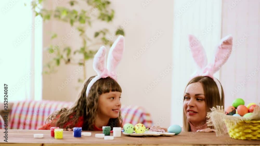 daughter with mother looking at the other and smiling laughing. daughter with mother looking at the other and smiling laughing.