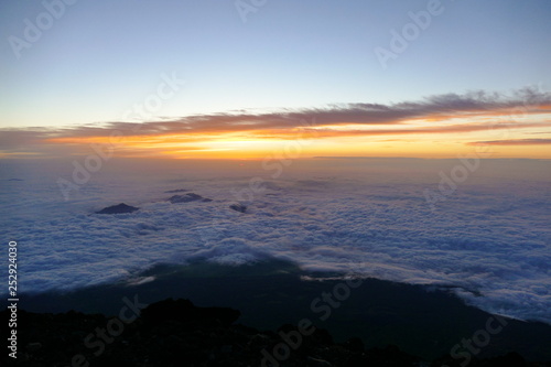 Sunrise over the clouds from the top of Mount Fuji  Japan
