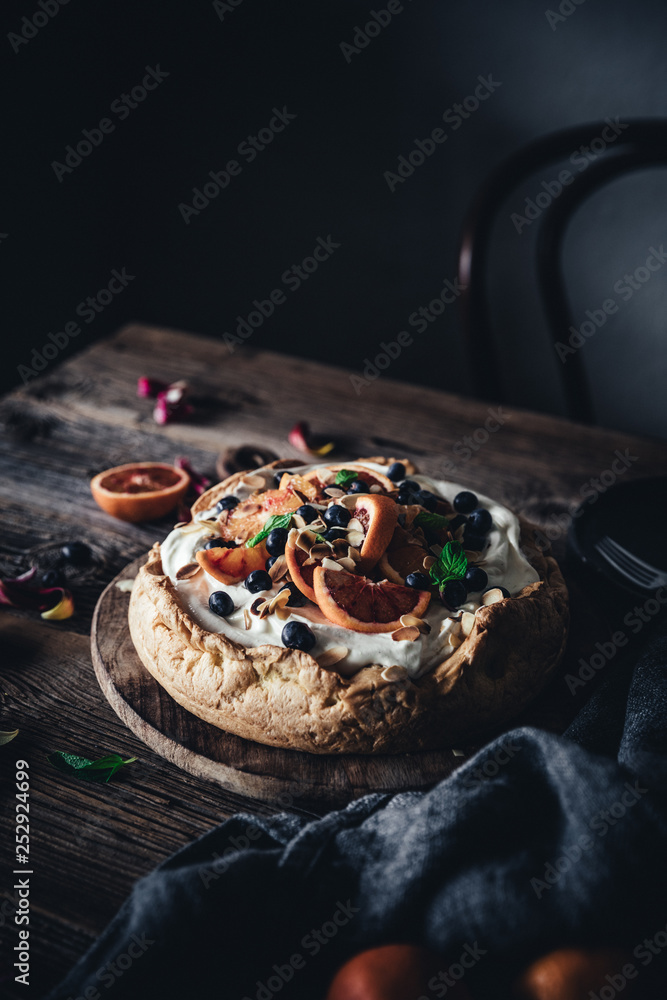 Choux pastry cheesecake on wooden table Choux pastry cheesecake on wooden table